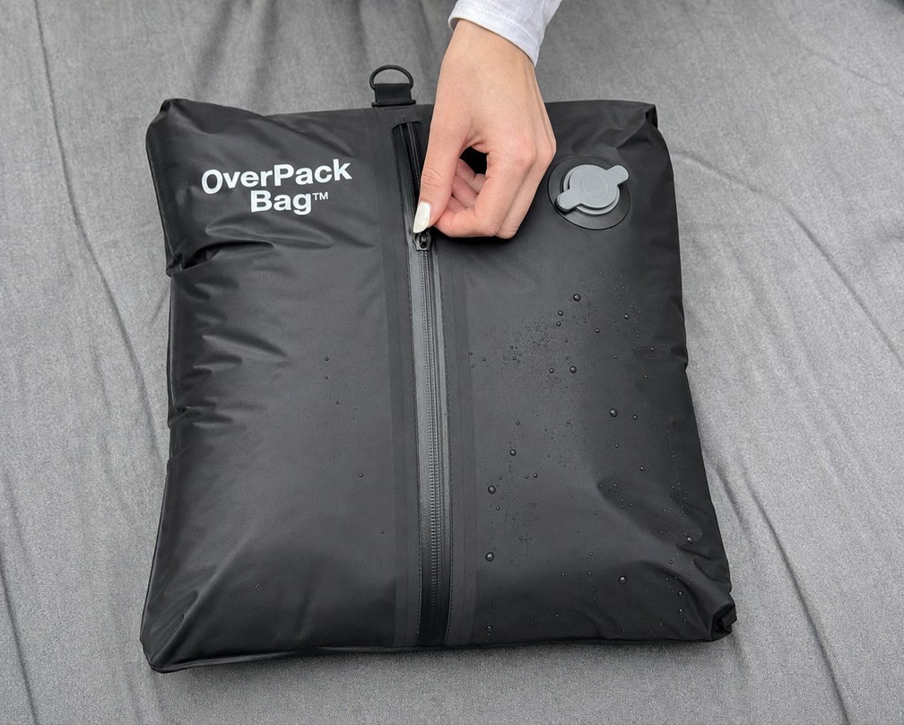Packing clothes into OverPack Bags in a carry-on